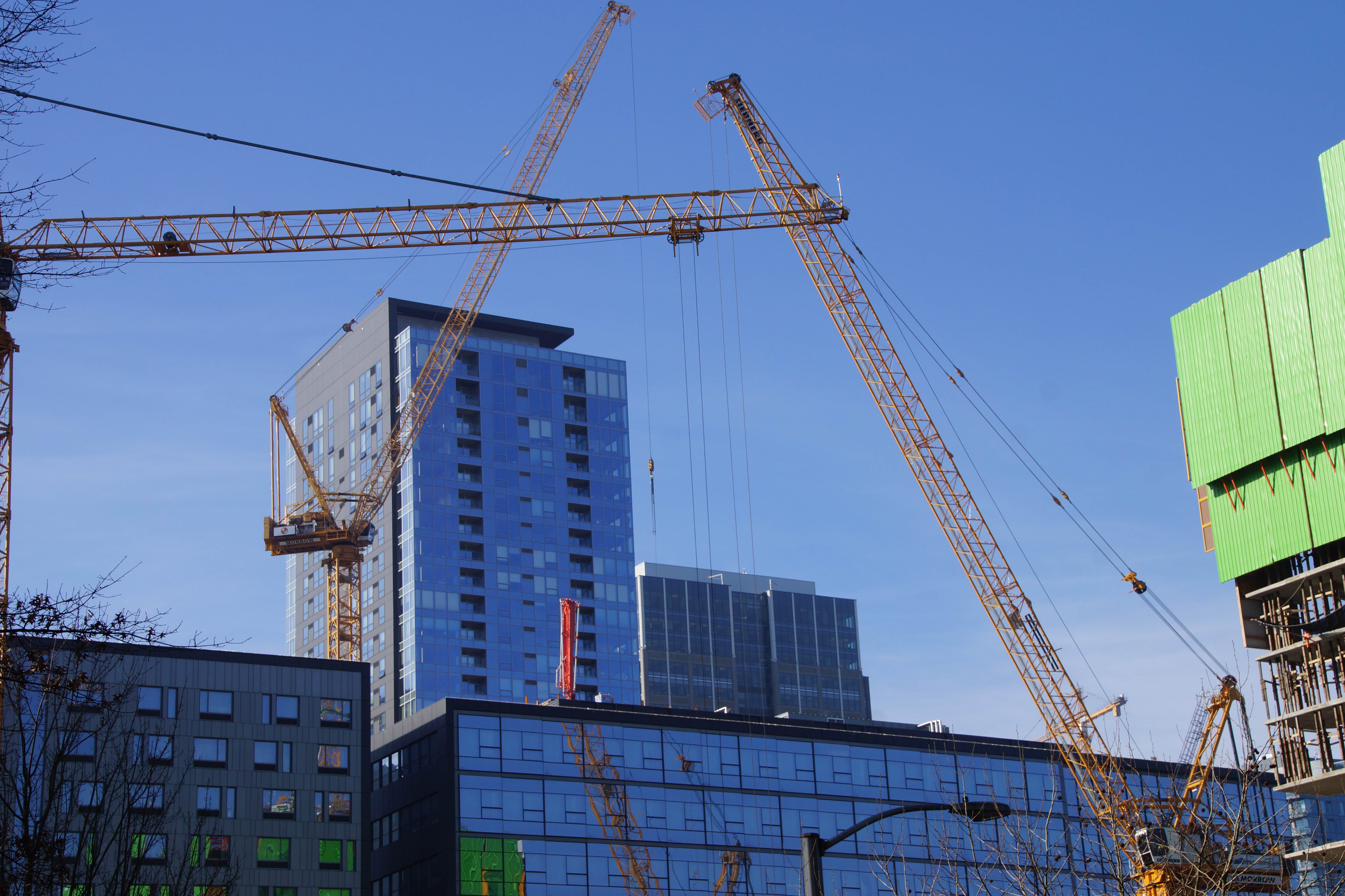 The downtown Seattle skyline reflects a surge of new development, as cranes hearken in new buildings amidst downtown Seattle's high-rises.