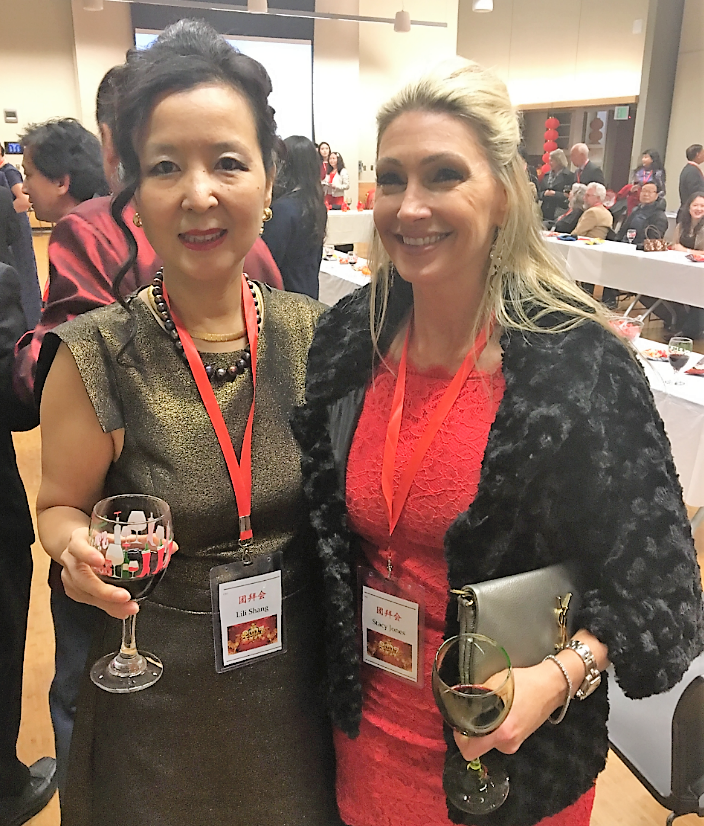 PICTURED ABOVE:  Asia Services Group member Lili Shang (left) and RSIR co-owner Stacy Jones (right) enjoy the Lunar New Year event. 